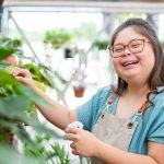 Woman with down syndrome working in small business