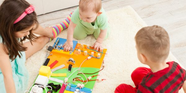 Three children playing with toys that help with Sensory Processing