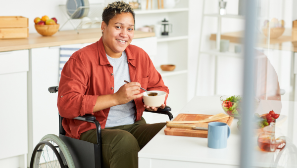 Disabled woman having breakfast